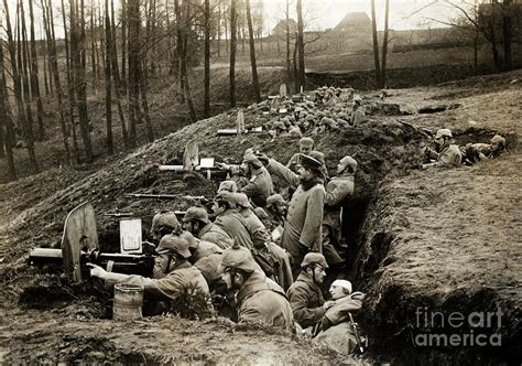 German Soldiers Fire From Trench In Wwi by Bettmann