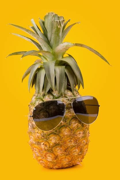 Premium Photo Trendy Glasses Summer Pineapple Wearing Hipster Style On Yellow Background