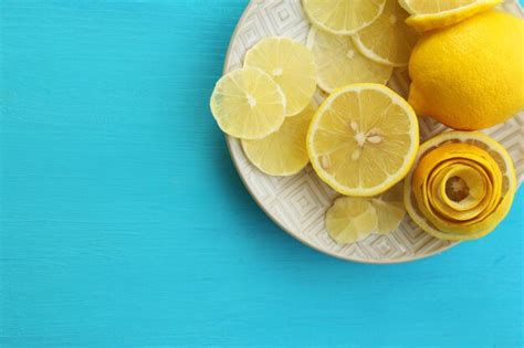 Premium Photo Ripe Lemons On Wooden Table Close Up