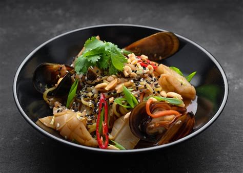 Premium Photo Pasta With Seafood Herbs Sesame Seeds And Nuts