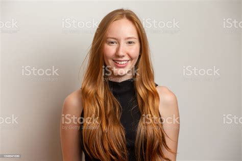 Portrait Of Beautiful Cheerful Redhead Girl Smiling Laughing Looking At