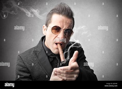 Man In Suit Smoking Cigar Stock Photo Alamy