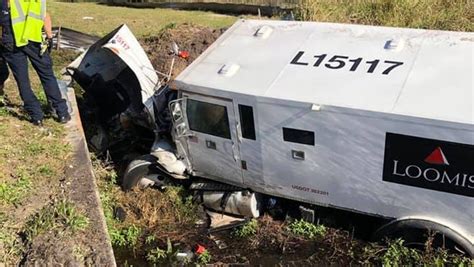 Armored Truck Flips Ends Up In Ditch Near Fort Pierce Two Injured