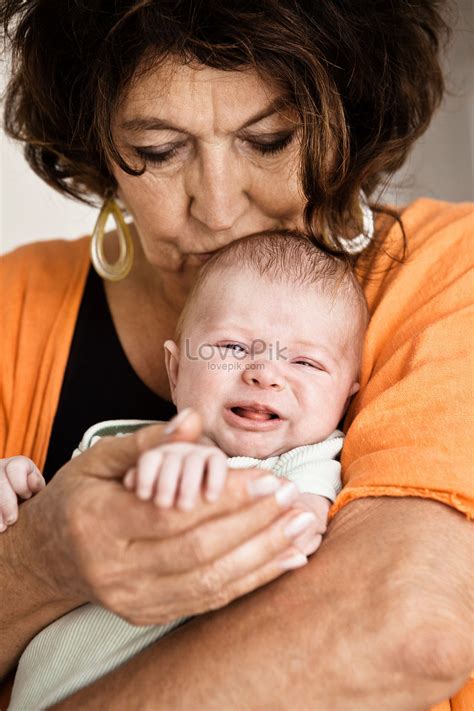 Grandma Holding Crying Baby Picture And Hd Photos Free Download On