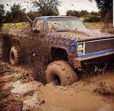 Muddy Jacked Up Chevy Trucks