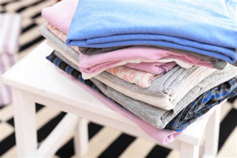 Stack Of Folded Clothes Stock Photo By ©belchonock 105079014