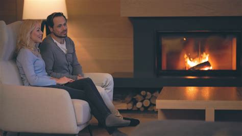 The Beautiful Romantic Couple Sitting Near The Fireplace Slow Motion