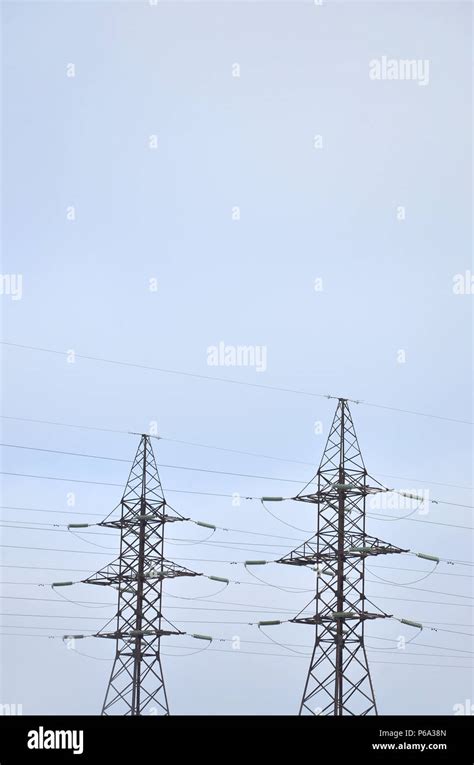 The Silhouette Of The Electricity Transmission Pylon In Daytime