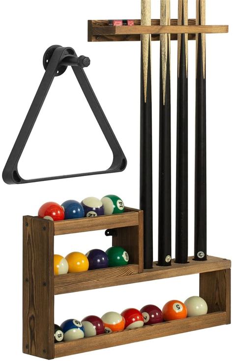 A Rack With Pool Balls And Cues In It Next To A Set Of Cues