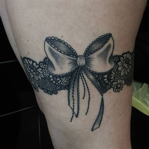 Charming Garter Tattoo Designs Using A Totem To Keep In Touch With