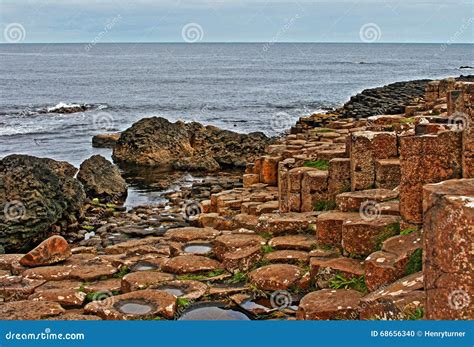 Giants Causeway Basalt Hexagonal Columns Leading Down Into The Sea