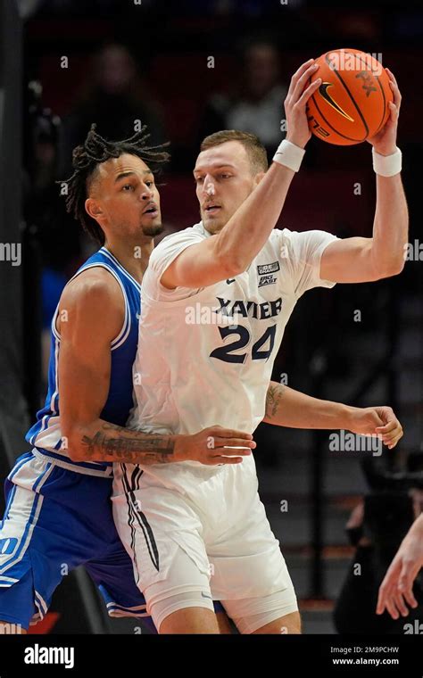 Duke Center Dereck Lively Ii Left Guards Xavier Forward Jack Nunge 24 During The Second Half