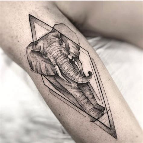 An Elephant Tattoo On The Right Arm And Leg With Geometric Shapes