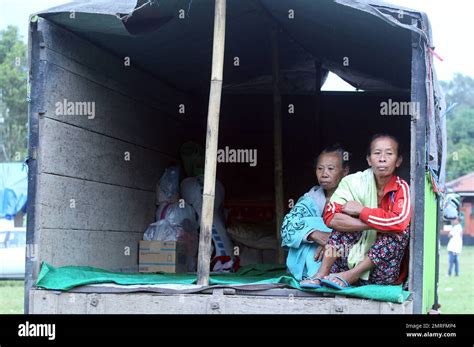 Women Sit On The Back Of A Truck As A Temporary Shelter In Bali