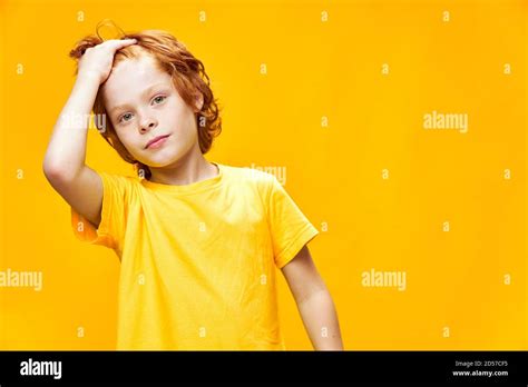 Portrait Of A Cute Little Boy With Ginger Haired Front View Yellow