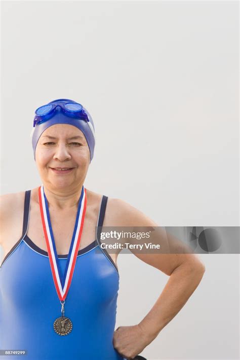 Hispanic Woman Swimmer Wearing Medal High Res Stock Photo Getty Images