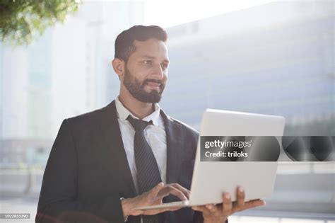 Businessman Using Laptop High-Res Stock Photo - Getty Images