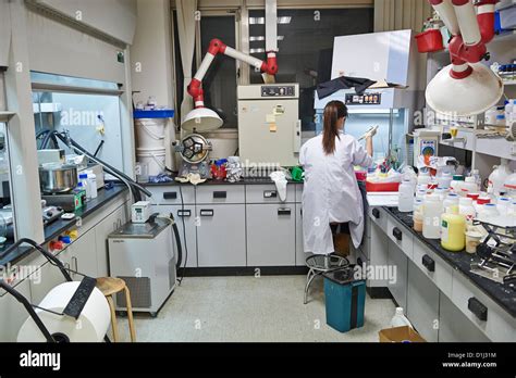 A Lab Worker Filling Test Tubes At A Textile Research Lab And Factory