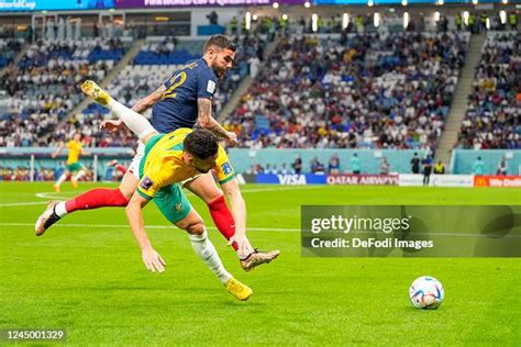 Aziz Behich Of Australia And Theo Hernandez Of France Battle For The