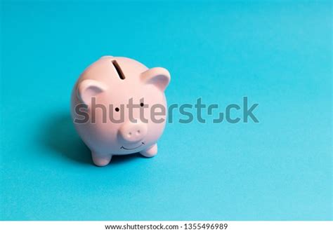 Piggy Bank On Blue Background Commercial Stock Photo Edit Now 1355496989