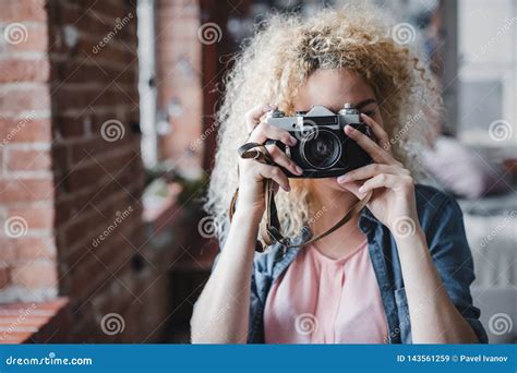 Curly Blonde Woman Holding Her Retro Photo Camera At Home Stock Image Image Of Holding