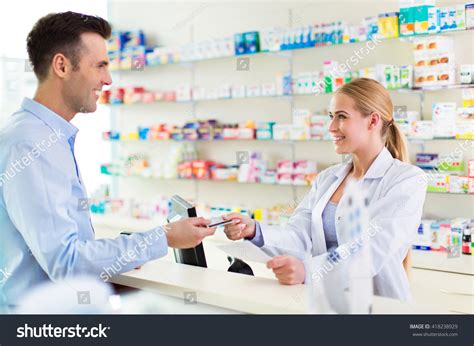 Pharmacist And Client At Pharmacy Stock Photo Shutterstock