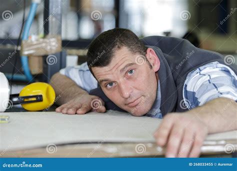 Man Controlling Hydraulic Press Machine For Cutting Steel Stock Image