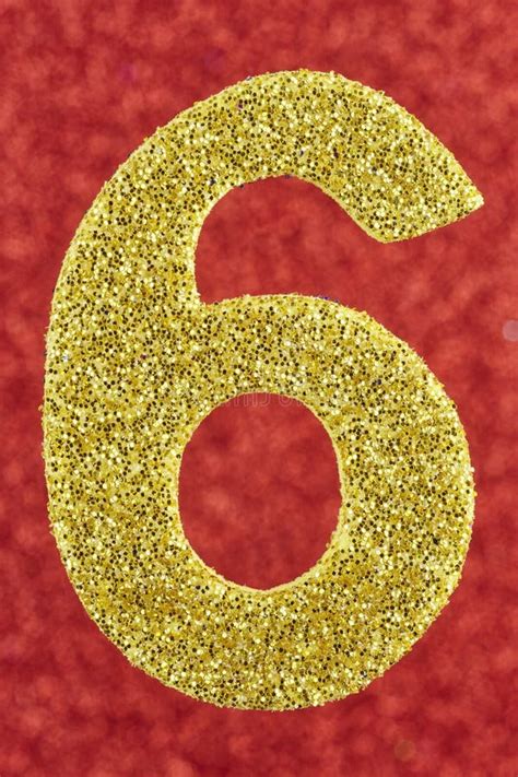 Number Six Gold Color Over A Red Background Anniversary Stock Photo