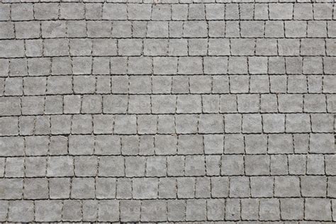 Gray Color Paving Slabs In The Pedestrian Street Sidewalk Rough