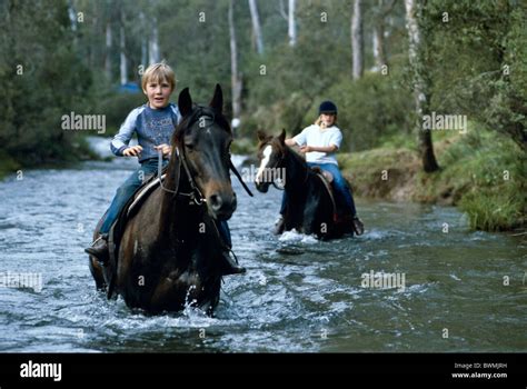 Country kids riding their ponies, Australia Stock Photo - Alamy