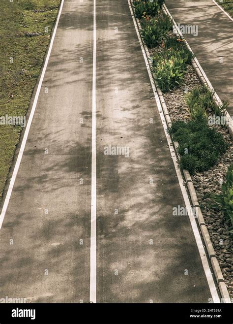 Top View Of Empty Road Texture With Median Strip In The Middle