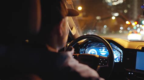 Man Driving Car Through Streets Of Night City Stock Footage Sbv