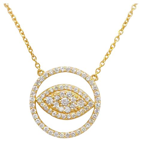 Diamond And Blue Sapphire Evil Eye Pendant Necklace In 14K Yellow Gold