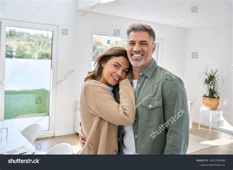 Smiling Middle Aged Mature Couple Embracing Stock Photo 2421700399 Shutterstock