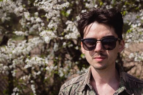 Premium Photo Portrait Of Man Wearing Sunglasses