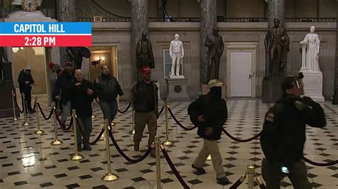 Rioters Walk Through Capitol Building Statuary Hall Outside Of House