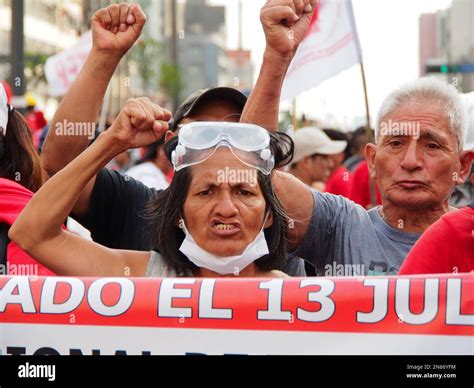 Peru An Indigenous Woman Raising Her Fist When Thousands