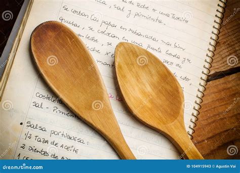 Wooden spoons and cookbook stock image. Image of white - 104915943