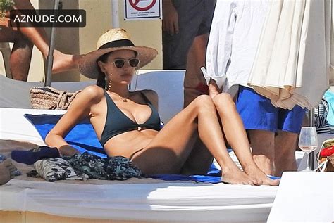 Alessandra Ambrosio Resting On A Beach In A Tiny Bikini And A Sun Hat In Ibiza Aznude