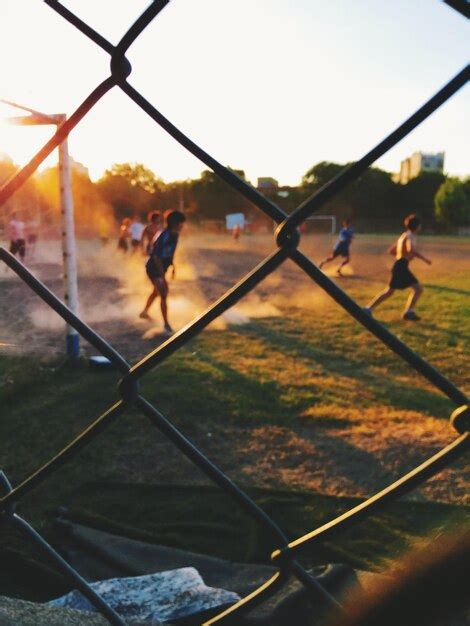 Premium Photo Teenage Kids Playing Soccer At Sunset