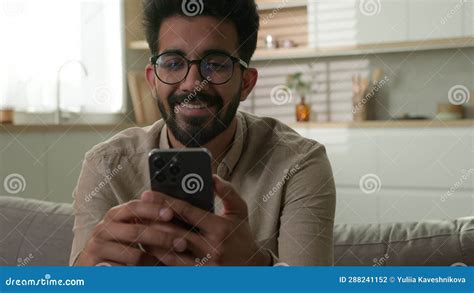 Indian Arabian Millennial Guy Happy Smiling Man Freelancer On Couch