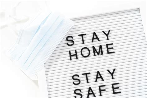 Premium Photo Stay Home And Stay Safe Sign On Message Board With A