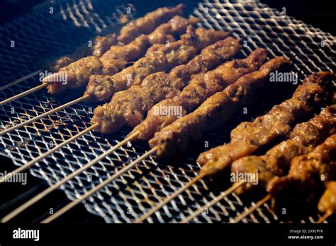 Chicken Satay On The Grill Being Grilled Stock Photo Alamy