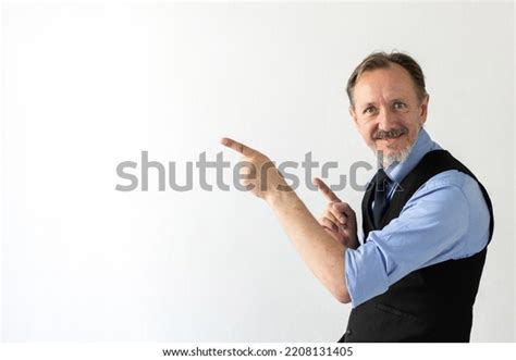 Portrait Happy Mature Businessman Pointing Finger Stock Photo