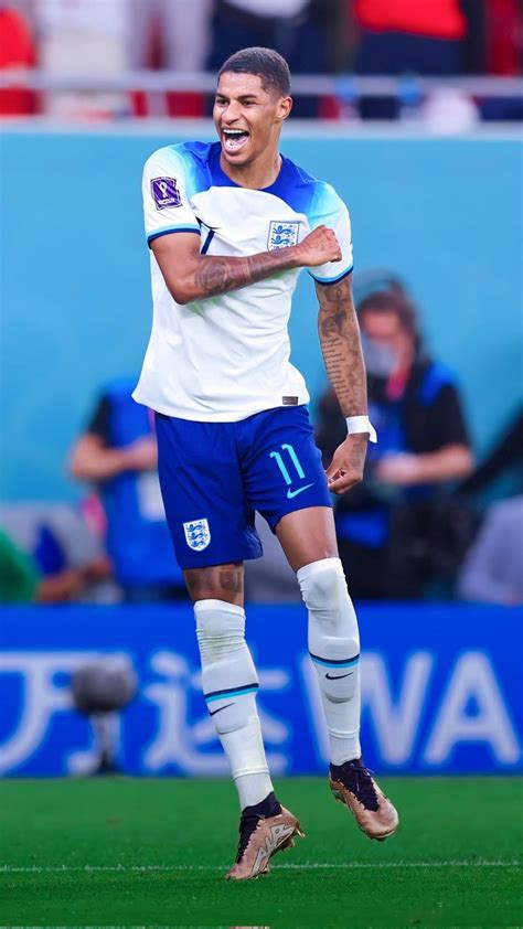 A Soccer Player With His Arms Crossed And Mouth Wide Open In