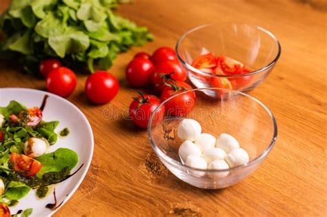 Bowl Of Small Mozzarella Balls With Tomatoes In Kitchen Stock Image
