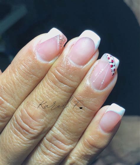 A Woman S Hand With Pink And White French Manies On Her Nails