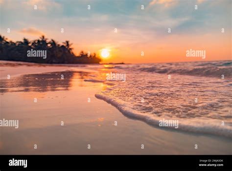 Fantastic Closeup View Of Calm Sea Water Waves With Orange Sunrise