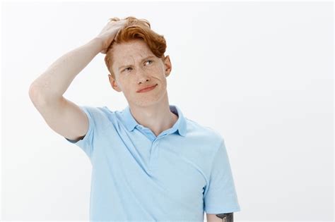 Free Photo Close Up Of Indecisive And Perplexed Redhead Man