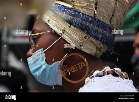 A Follower Of The Afro Brazilian Religion Umbanda Takes Part In A March